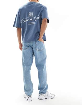 ASOS DESIGN low rise baggy jeans in mid wash blue