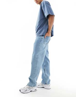 ASOS DESIGN low rise baggy jeans in mid wash blue