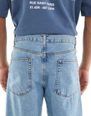 ASOS DESIGN low rise baggy jeans in mid wash blue
