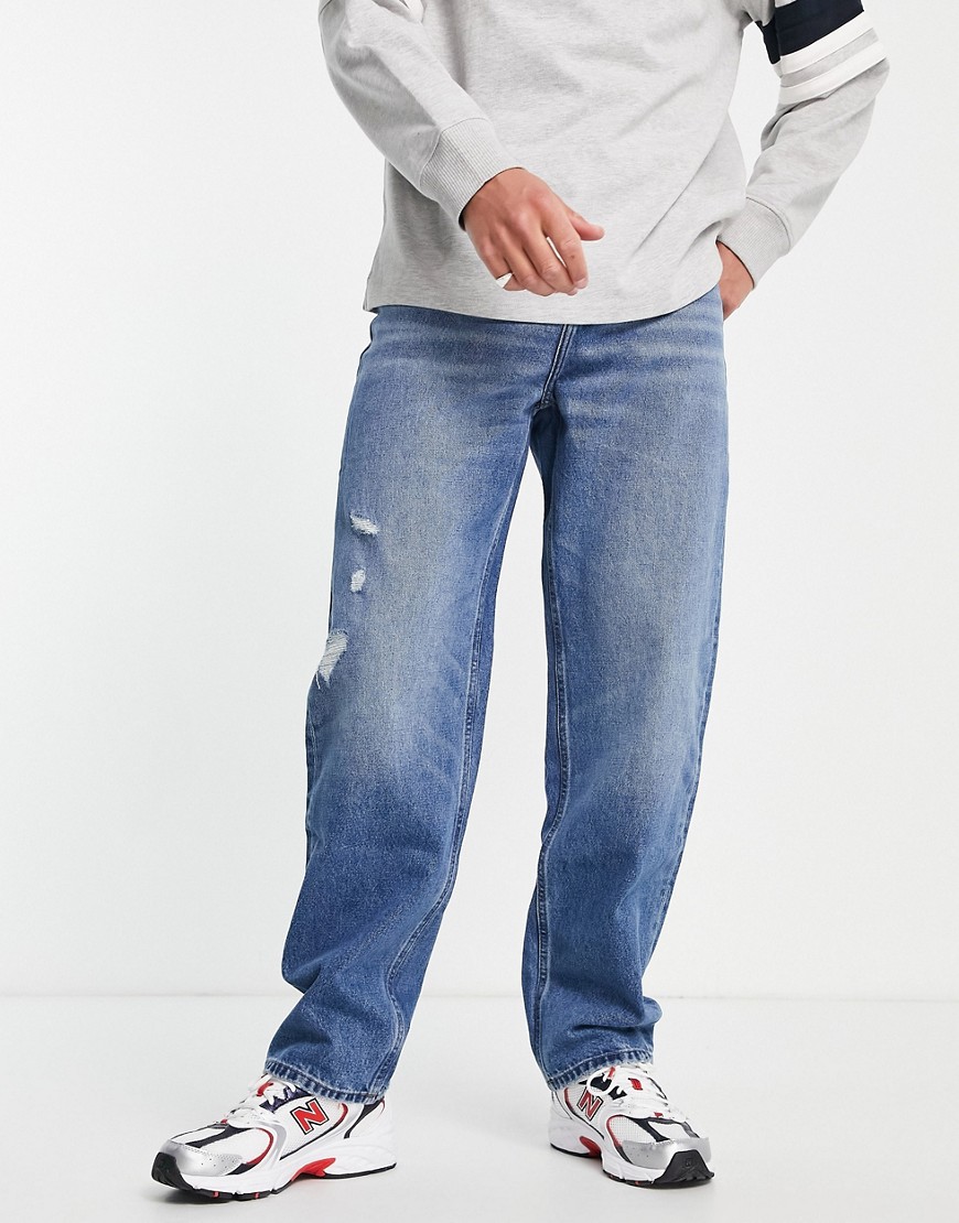 ASOS DESIGN baggy jeans in mid wash with abrasions-Blue