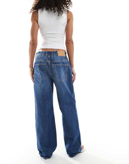 ASOS DESIGN - Baggy jeans met lage taille in donkerblauw met gebloemd patchwork-detail , 3 van 5