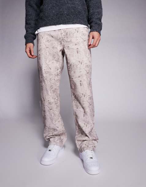 ASOS DESIGN - Baggy jeans met print in mid-wash - view 1
