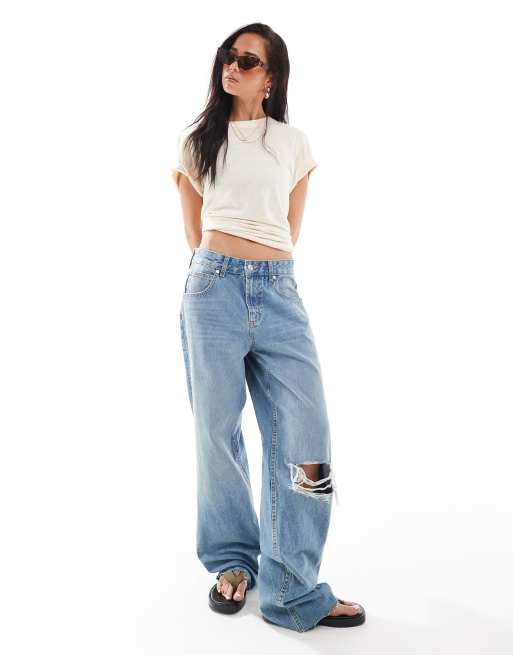 ASOS DESIGN - Baggy jeans met scheuren in middenblauw