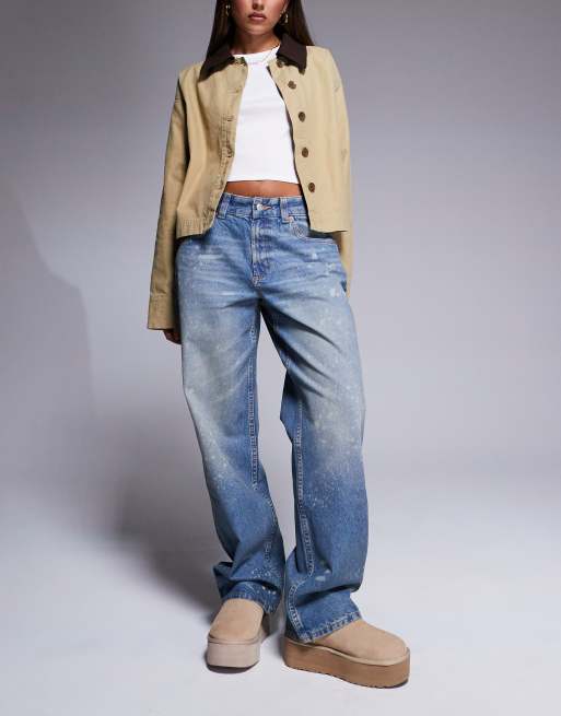 ASOS DESIGN baggy jeans with paint splats in mid blue