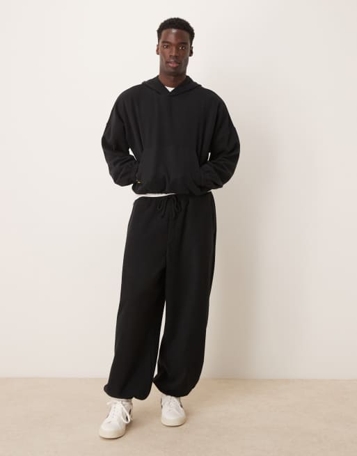 ASOS DESIGN - Baggy joggingbroek van zware geborstelde ribstof met ballonpijpen in zwart, deel van co-ord set
