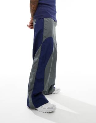 baggy nylon track pants in gray with blue panels