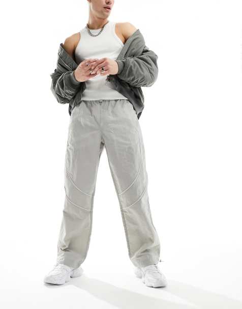 ASOS DESIGN baggy nylon track pants with contrast piping in stone - view 1