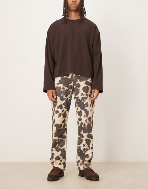 ASOS DESIGN baggy pants in cow print - view 1
