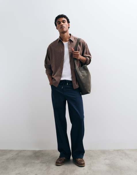 ASOS DESIGN baggy pants in navy with belt - view 1