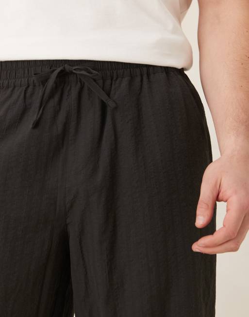 ASOS DESIGN baggy striped pants in black