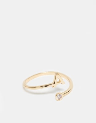 ASOS DESIGN - Bague enveloppante ornée d'un zircon cubique et d'une initiale A » avec pochette cadeau - Doré