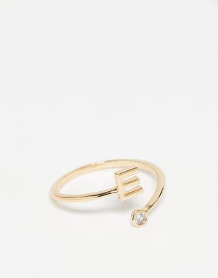 ASOS DESIGN - Bague enveloppante ornée d'un zircon cubique et d'une initiale E » avec pochette cadeau - Doré