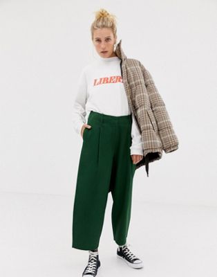 ASOS DESIGN balloon leg pants with lace up back in green | ASOS
