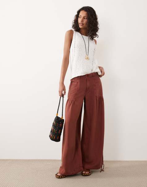 ASOS DESIGN balloon pants with front pockets and adjustable tie hem in rust - view 1