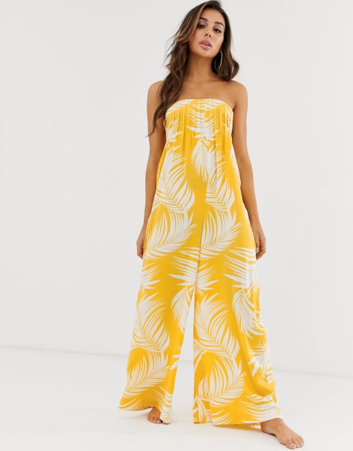 ASOS DESIGN bandeau beach jumpsuit with shirring in yellow palm outline