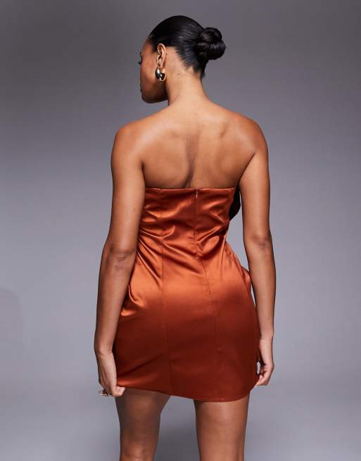 ASOS DESIGN bandeau satin structured dress with undone corsage and pleat skirt in burnt orange