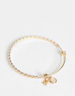 ASOS DESIGN bangle bracelet with opal and star charm in gold tone