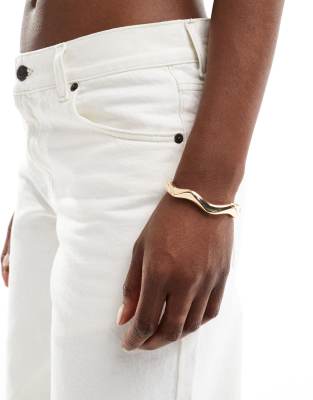 ASOS DESIGN ASOS DESIGN bangle bracelet with wave detail in gold tone