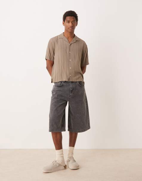 ASOS DESIGN – Bardzo długie szerokie szorty jeansowe w spranym brązowym kolorze - view 1