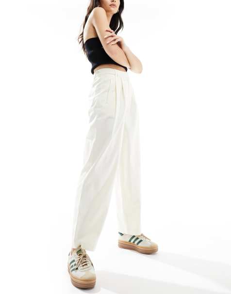 ASOS DESIGN barrel leg chino trousers with button tab detail in cream - view 1