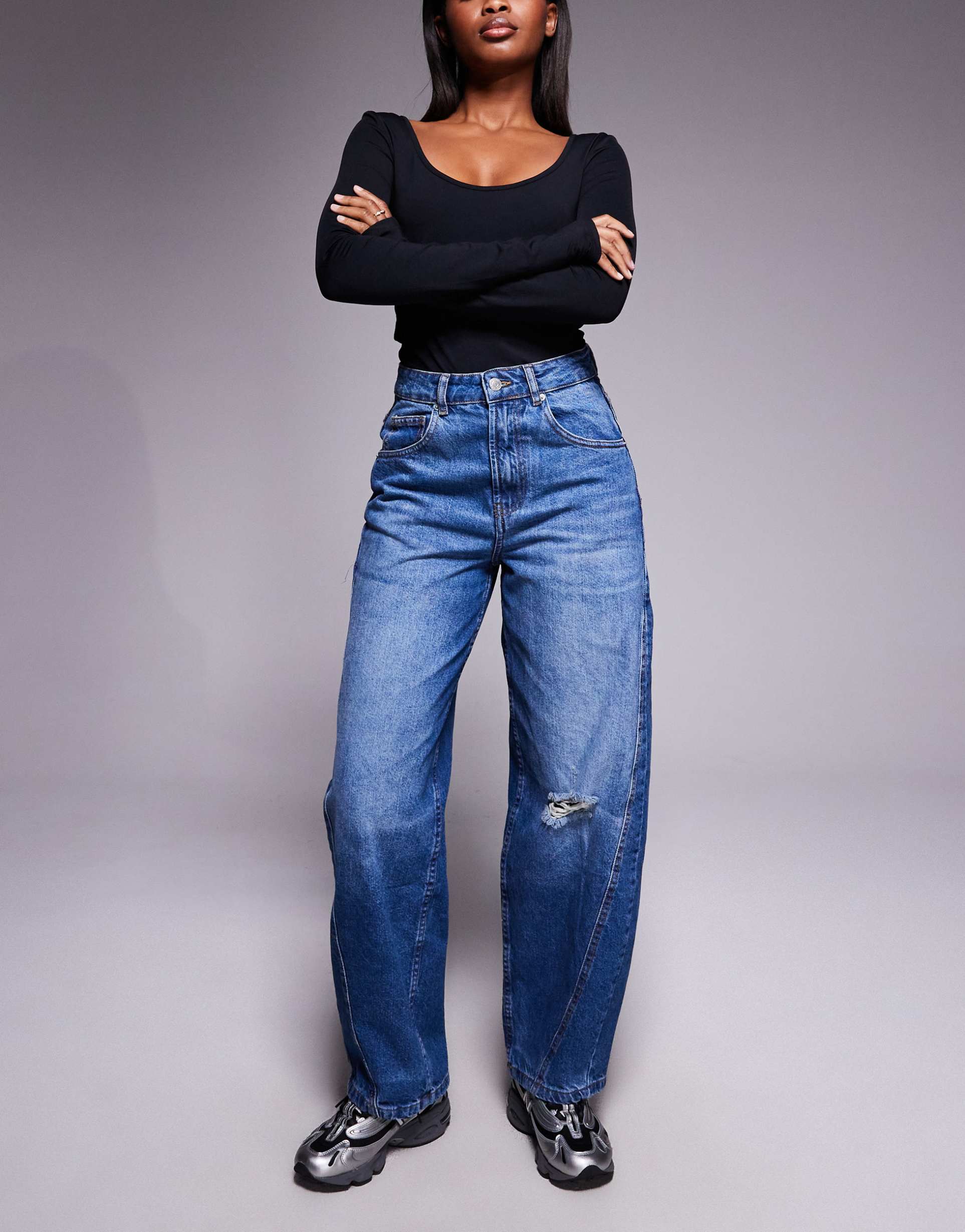 asos design barrel leg jeans with paneling and cinching in midwash with rips