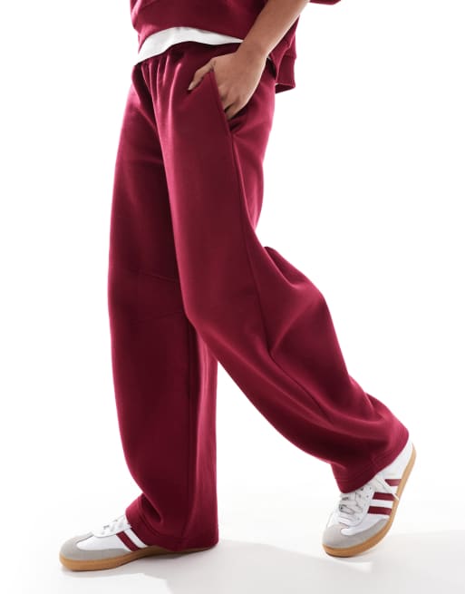 ASOS DESIGN barrel leg trackies in burgundy