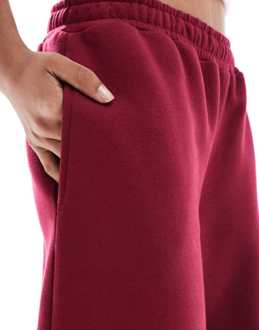 ASOS DESIGN barrel leg trackies in burgundy
