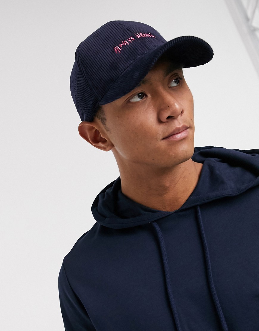 ASOS DESIGN baseball cap in navy cord with text embroidery