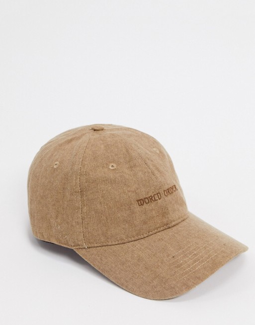 ASOS DESIGN baseball cap with washed effect and slogan print in brown