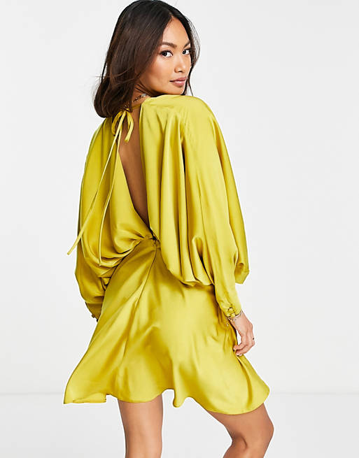  batwing satin mini dress with bias cut skirt and tie back in gold 