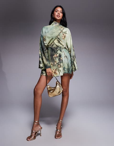 ASOS DESIGN batwing wrap high neck playsuit in green floral print - view 1
