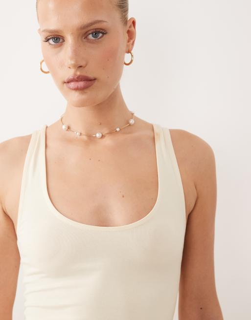 ASOS DESIGN – Baumwoll-Minikleid in Buttermilchgelb mit tief angesetzter Taille und Rockteil mit Knitterstruktur, 3 von 4