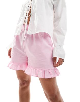 ASOS DESIGN - Baumwoll-Shorts in Rosa mit Rüschensaum