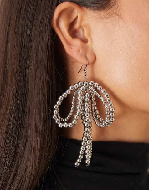 ASOS DESIGN beaded bow statement earrings in silver tone - view 1