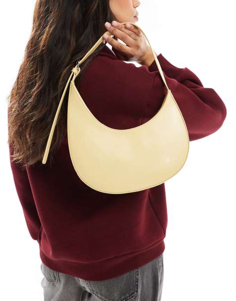 ASOS DESIGN – Beige, asymmetrisk axelväska med böjd design och spänne - view 1