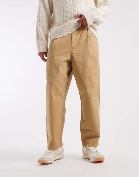 ASOS DESIGN – Beige, avsmalnande byxor i dra på-modell och relaxed fit - view 1