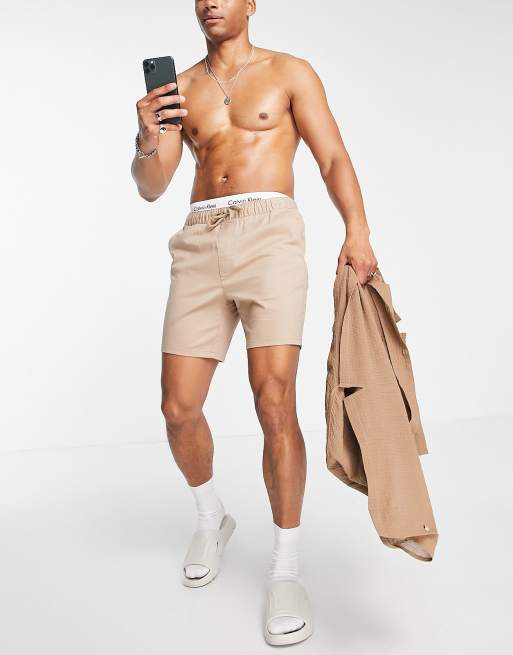 ASOS DESIGN – Beige chinosshorts med elastisk midja och smal passform