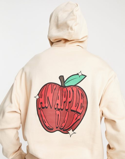 ASOS DESIGN – Beige huvtröja i oversize med tecknat äpple baktill