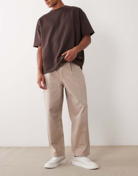 ASOS DESIGN – Beige, tvättade, avsmalnande jeans med avslappnad passform och veck - view 1