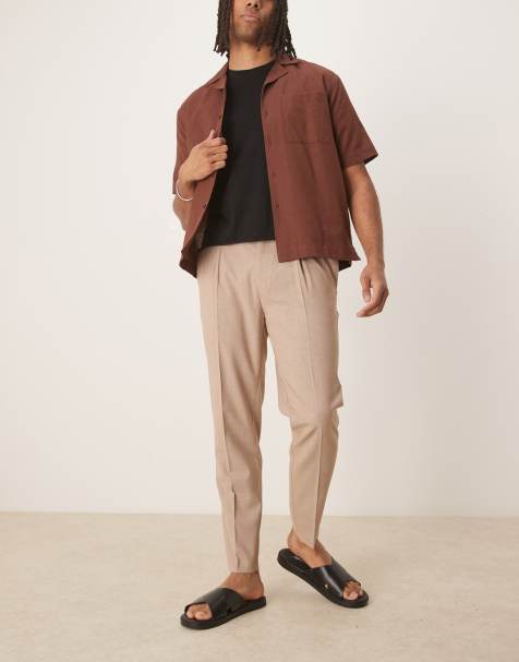ASOS DESIGN – Beigemelerade finbyxor med avsmalnande passform och veck framtill - view 1