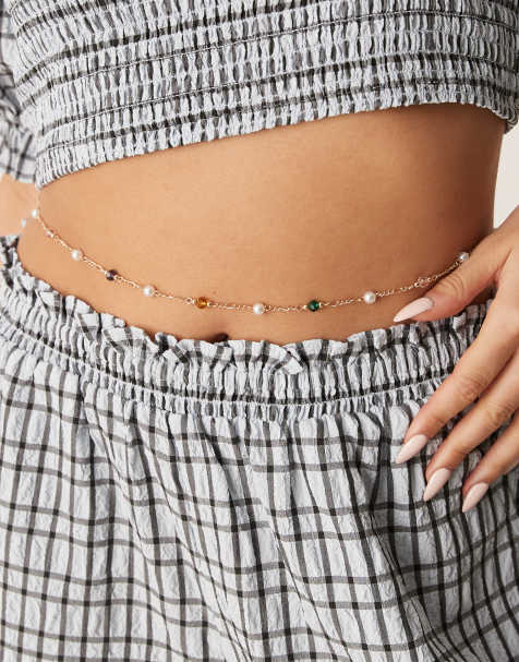 ASOS DESIGN belly chain with bead and faux pearl detail in gold tone - view 1