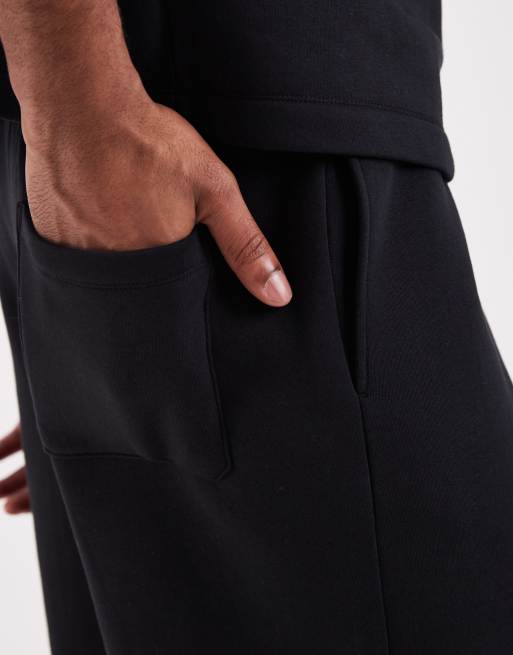 ASOS DESIGN - Bermudas negras extragrandes de punto liso (parte de un conjunto), 4 de 5