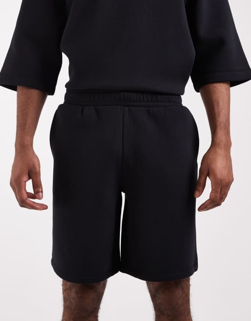 ASOS DESIGN - Bermudas negras extragrandes de punto liso (parte de un conjunto), 5 de 5