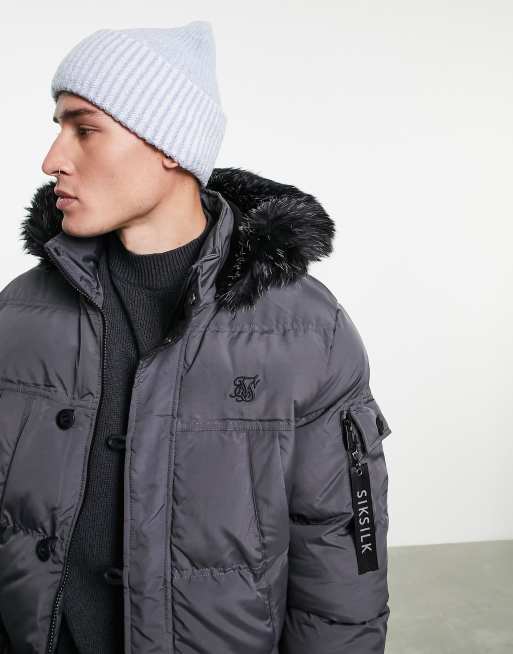 ASOS DESIGN - Berretto a coste bicolore blu e bianco con risvolto ampio