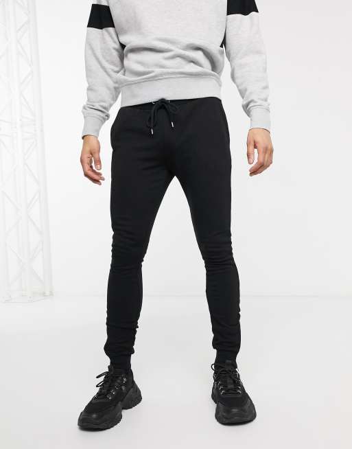 ASOS DESIGN – Besonders enge Jogginghose in Schwarz mit silbernen Reißverschlüssen an den Bündchen
