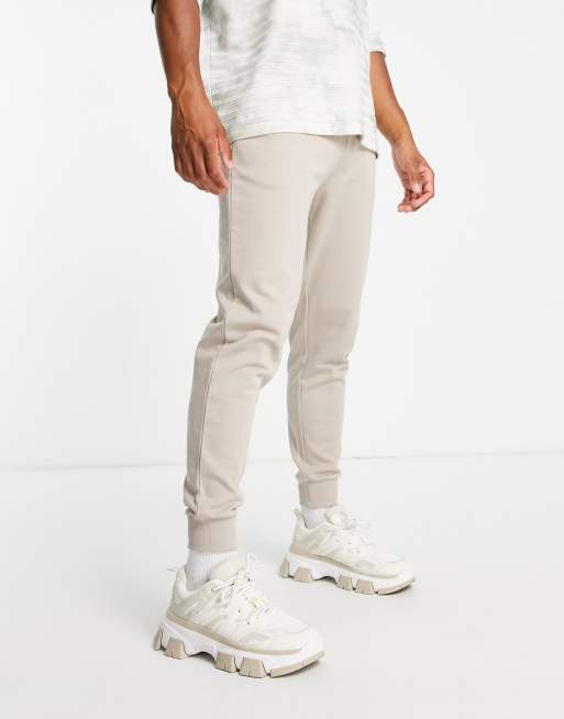 ASOS DESIGN – Beżowe joggersy ze zwężanymi nogawkami
