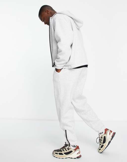 ASOS DESIGN – Białe melanżowe joggersy oversize z zamkami w sportowym stylu w dole nogawek – część zestawu