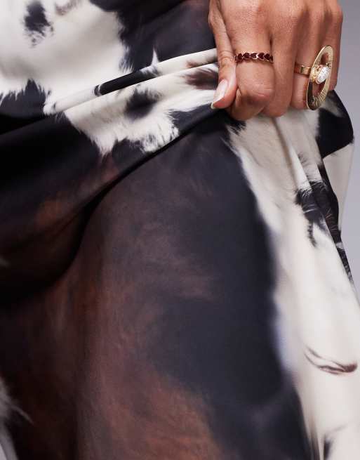 ASOS DESIGN bias cut maxi skirt in cow print