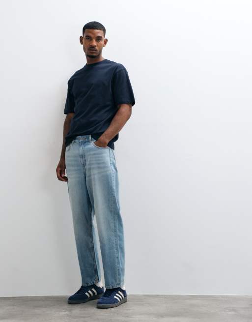 ASOS DESIGN - Blå afslappede tapered jeans i lys vintagevask