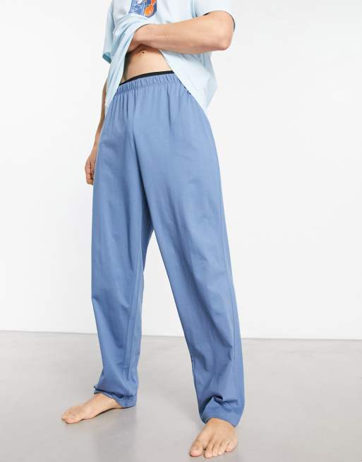 ASOS DESIGN – Blå pyjamas med byxor och t-shirt med apelsintryck, 2 av 4